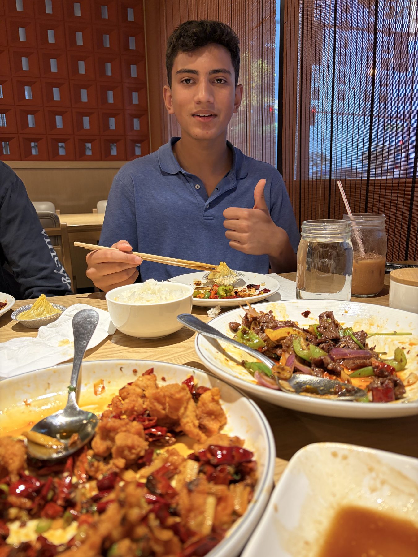 Me smiling at a restaurant